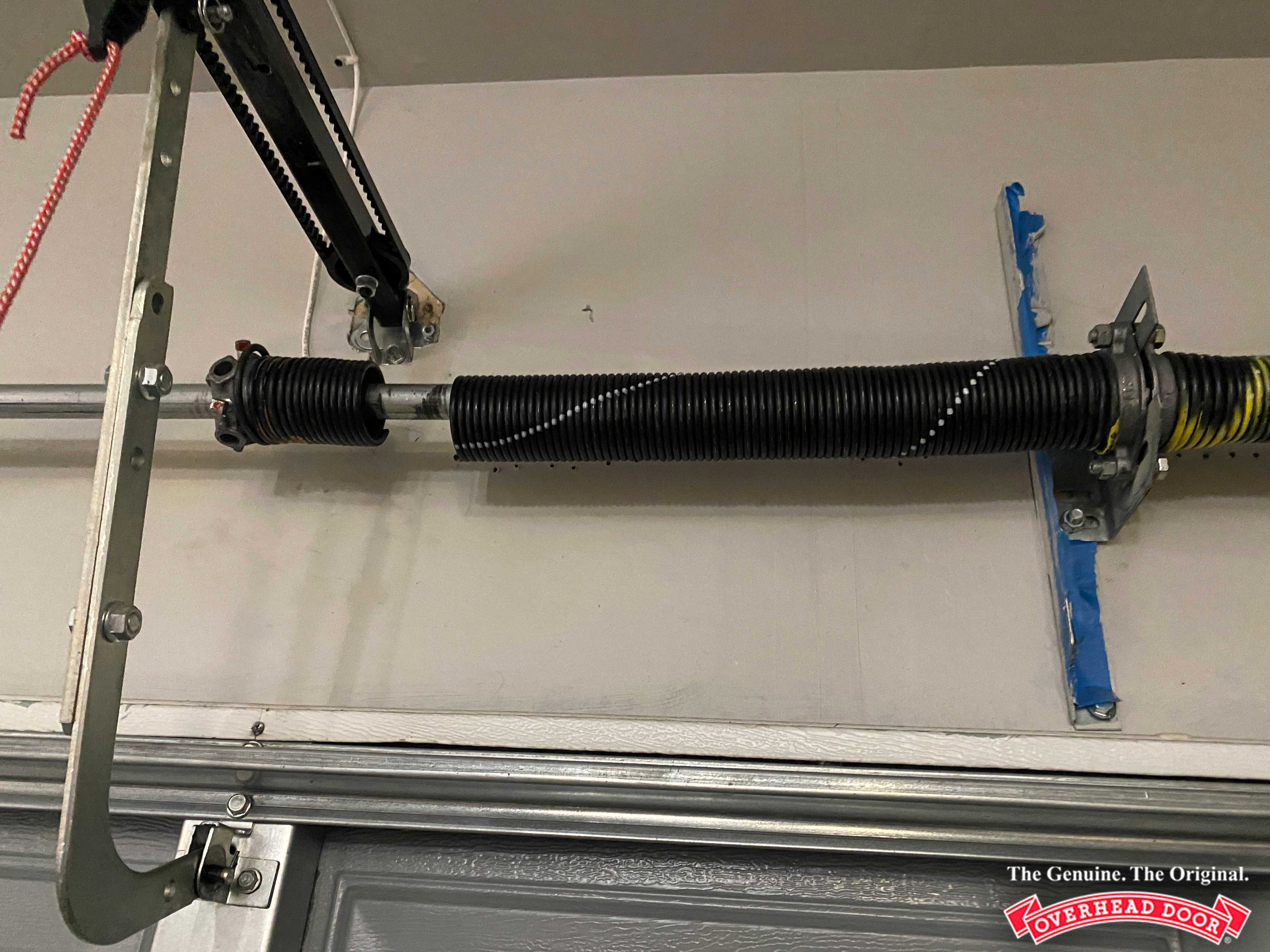 Garage Door Torsion Spring Repair service by Overhead Door™ technician