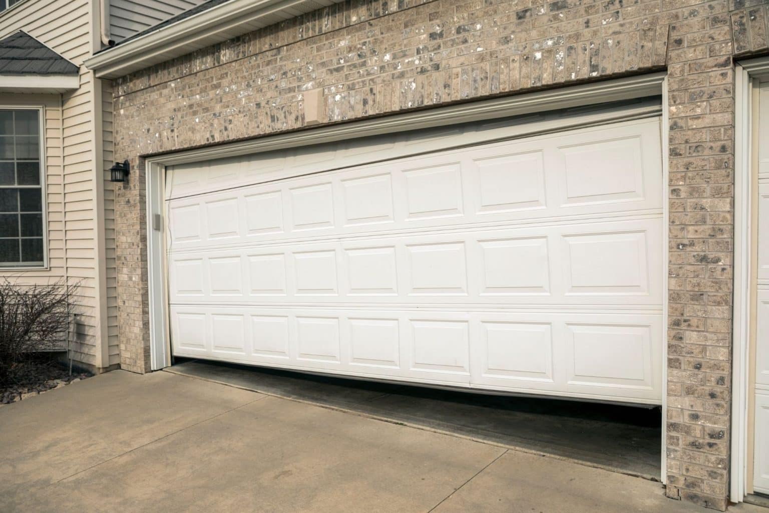 how-to-fix-a-crooked-garage-door-overhead-door-company